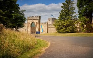 Ford castle courtyard and entrance with decorative flags hanging below the walls