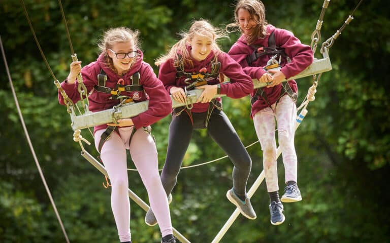 Children on the giant swing at a PGL centre.