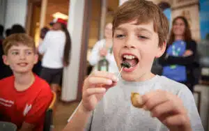 Student trying food on a PGL trip