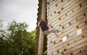 Child on the climbing wall at PGL Liddington