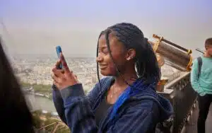 Student taking a photograph of Paris