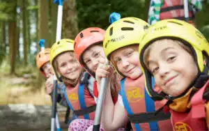 Students posing for a picture and ready to go canoeing