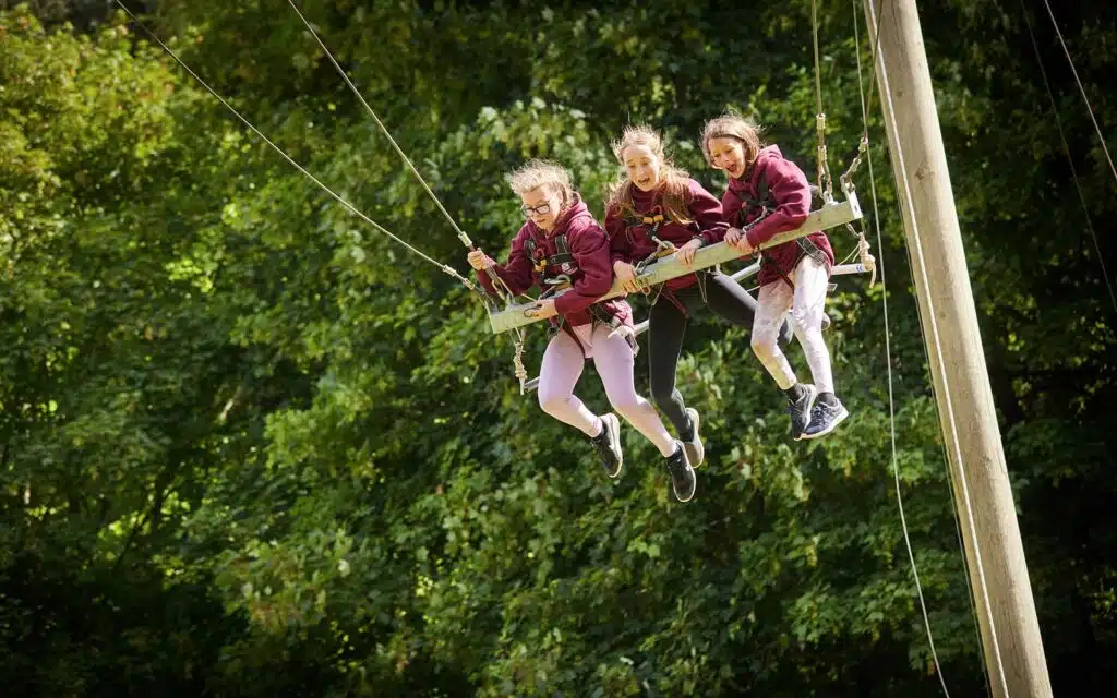 Children on the giant swing as part of multi-activity weekend
